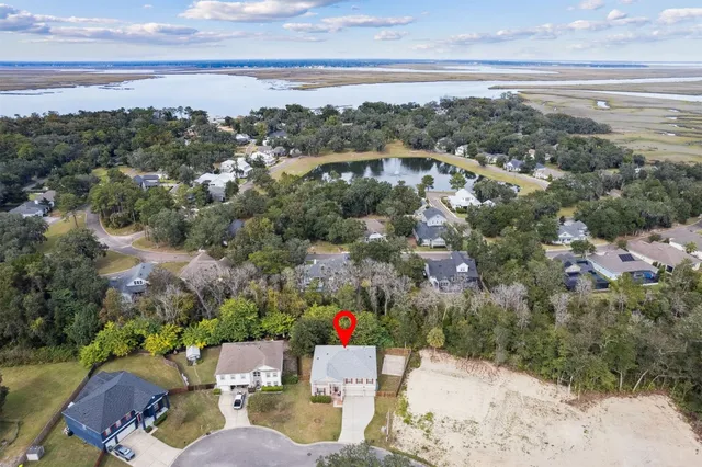 an aerial view of house with yard and mountain