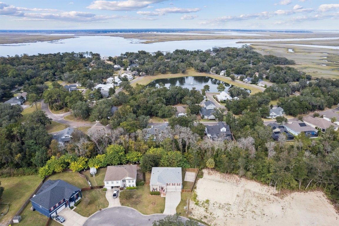 97042 Huntington Court Yulee, FL 32097 - Photo 48 of 54 an aerial view of a house with a lake view