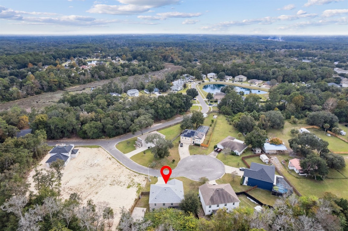 97042 Huntington Court Yulee, FL 32097 - Photo 51 of 54 an aerial view of house with yard and mountain