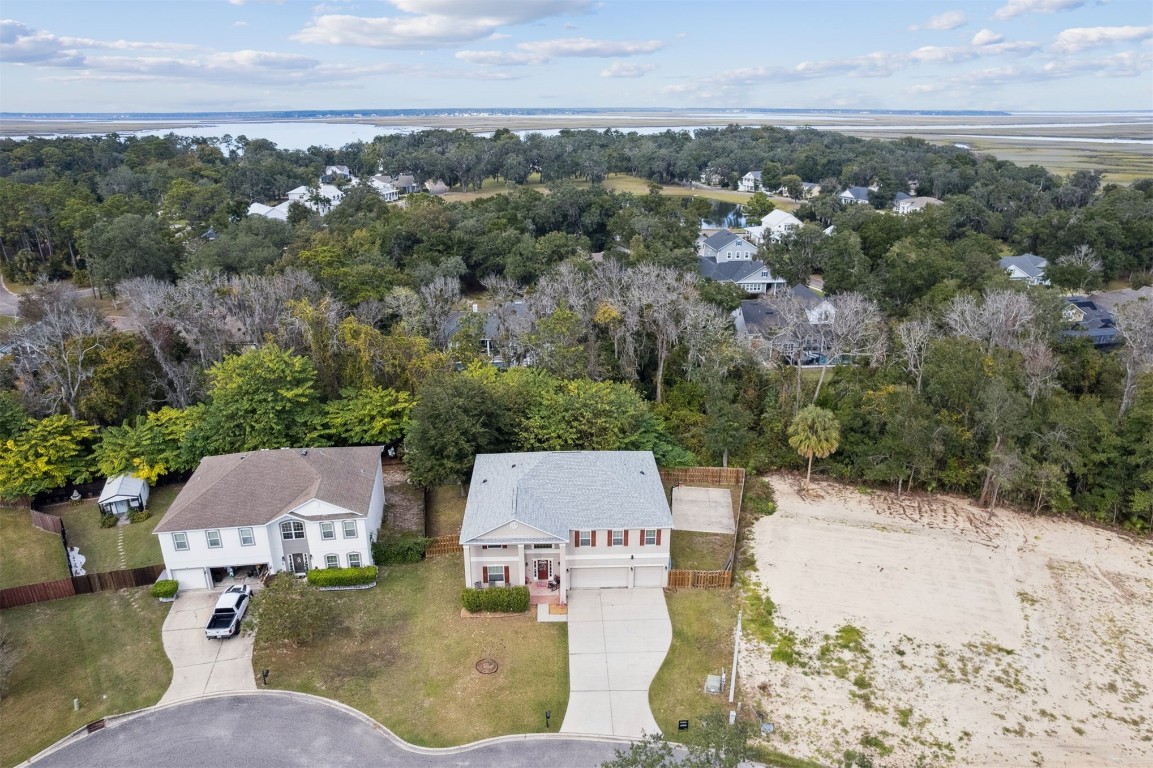 97042 Huntington Court Yulee, FL 32097 - Photo 53 of 54 an aerial view of a house with yard and outdoor seating