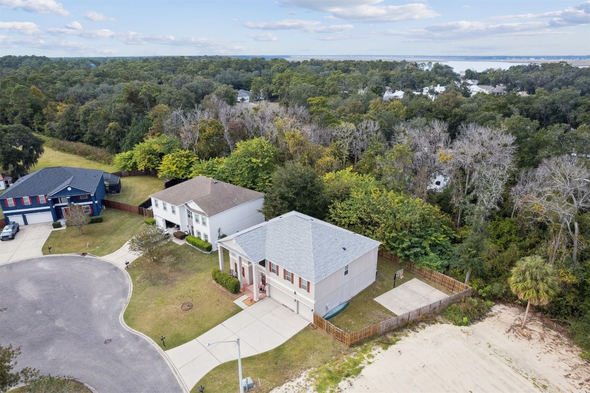97042 Huntington Court Yulee, FL 32097 - Photo 54 of 54 an aerial view of a house with yard and green space