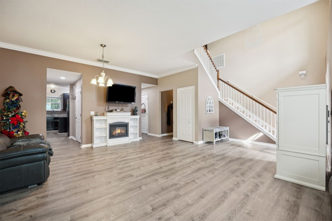 97042 Huntington Court Yulee, FL 32097 - Photo 6 of 54 a view of a living room with furniture and a flat screen tv