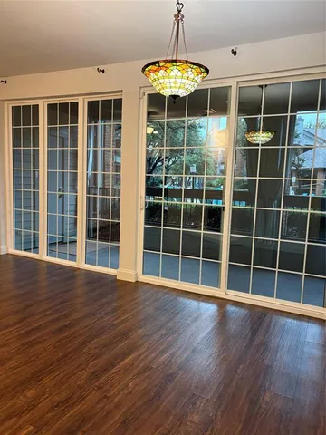 a view of wooden floor with a window