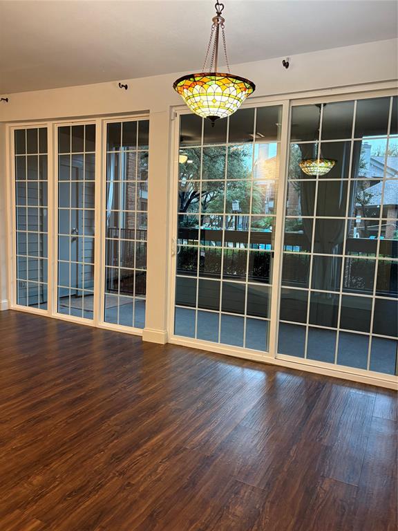 a view of wooden floor with a window