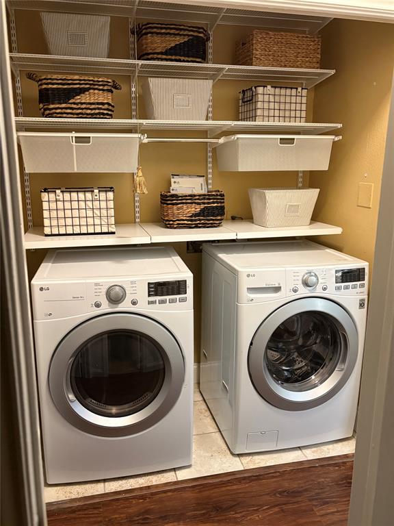 1720 Northeast Green Oaks Boulevard, Unit 104 Arlington, TX 76006 - Photo 4 of 13 a close up view of washer and dryer