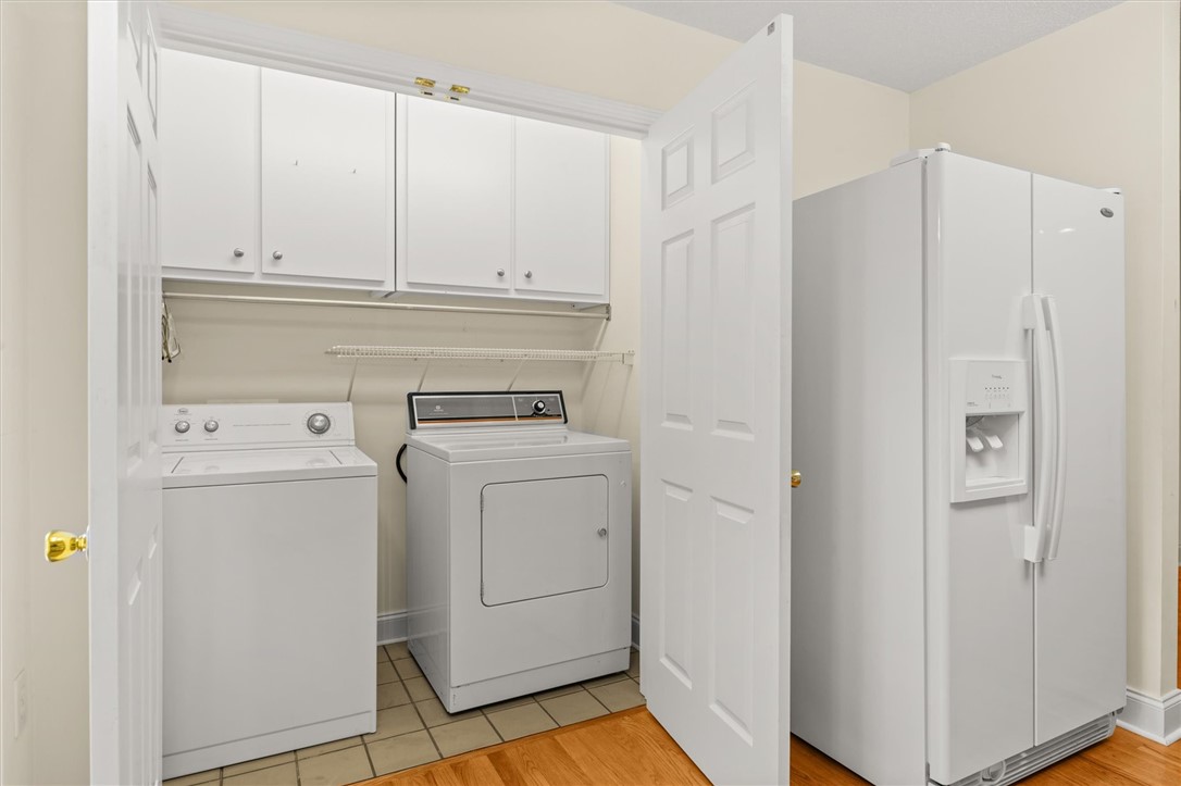 111 Park Way Anderson, SC 29625 - Photo 12 of 19 This dedicated laundry space combines convenience with practical storage solutions.