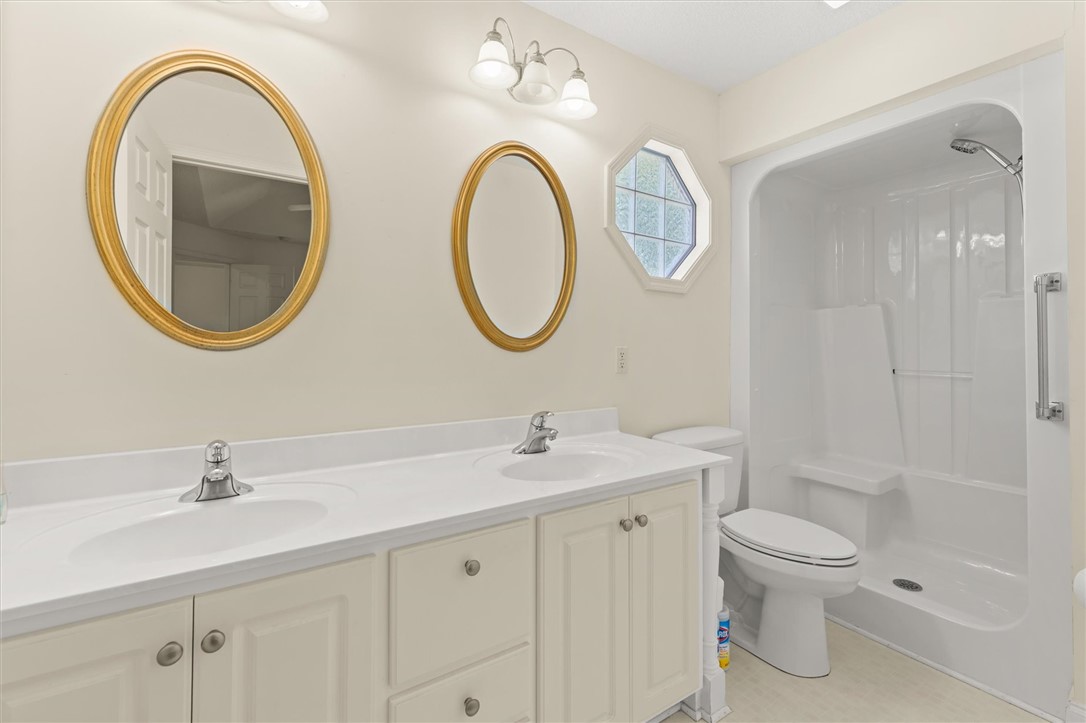 111 Park Way Anderson, SC 29625 - Photo 16 of 19 This bright bathroom features a spacious double vanity and a convenient walk-in shower.