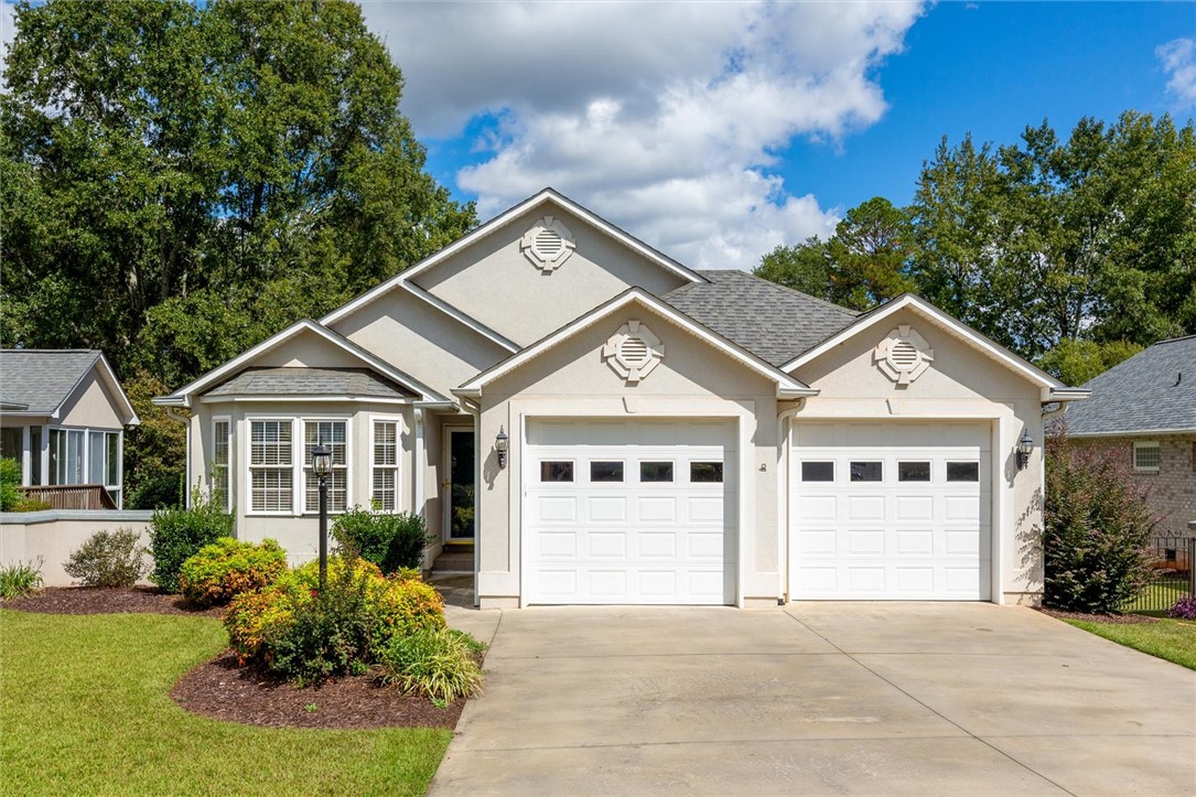 111 Park Way Anderson, SC 29625 - Photo 2 of 19 This charming residence features an inviting facade with an attached two-car garage.