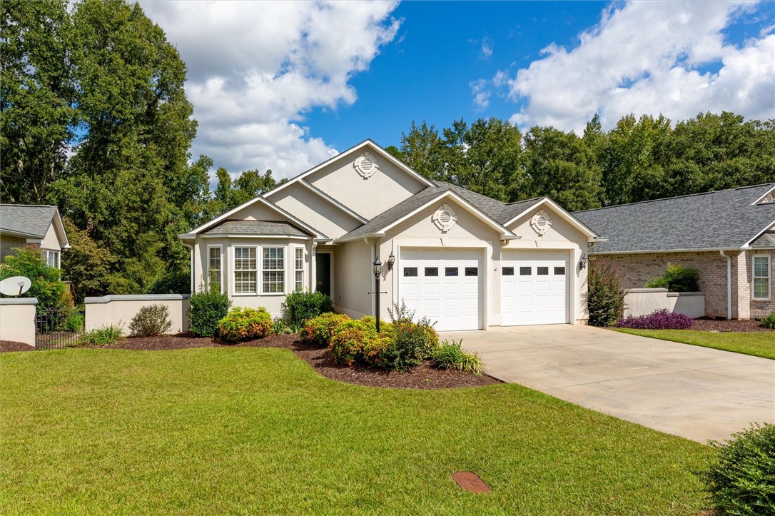 111 Park Way Anderson, SC 29625 - Photo 4 of 19 This appealing residence features a well-kept lawn and an attached garage with a paved driveway.