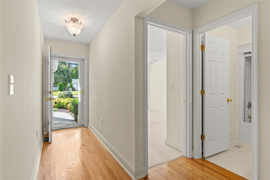 111 Park Way Anderson, SC 29625 - Photo 6 of 19 This bright entry welcomes you with natural light and classic hardwood flooring.