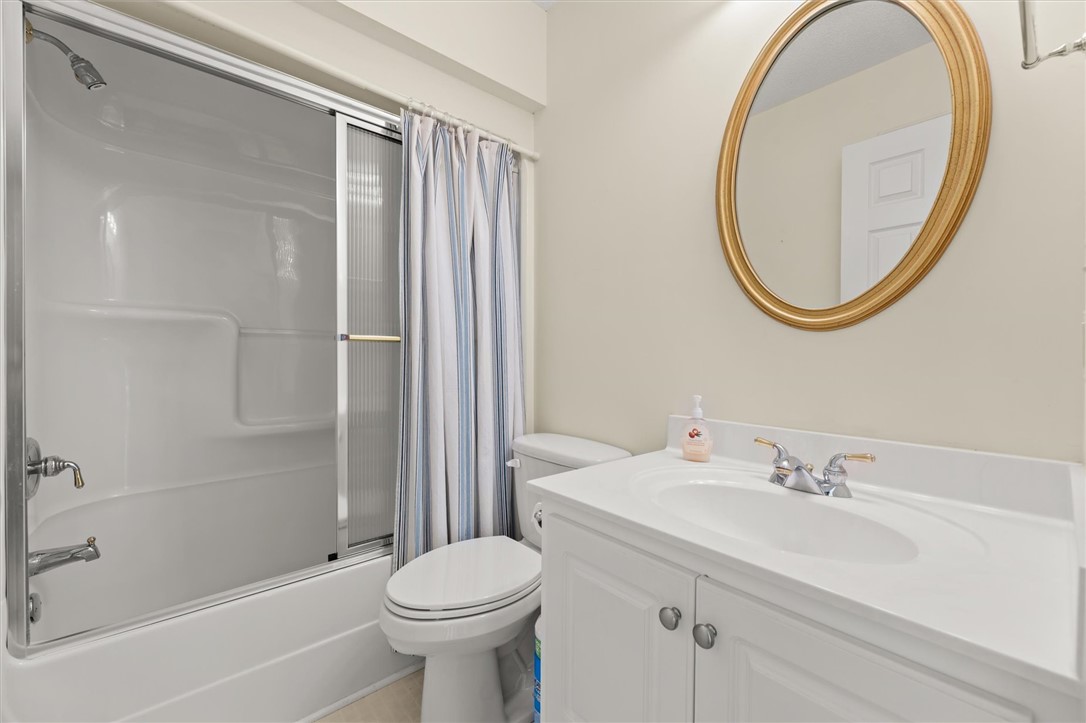 111 Park Way Anderson, SC 29625 - Photo 8 of 19 This bathroom features a sleek vanity and a tub with a shower for daily routines.