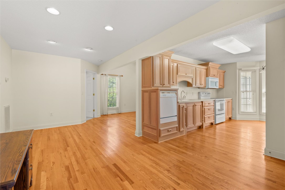 111 Park Way Anderson, SC 29625 - Photo 10 of 19 This inviting space features an open-concept kitchen with gleaming hardwood floors and ample natural light.