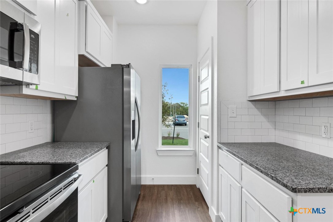 1920 Royal Loop Belton, TX 76513 - Photo 3 of 15 a kitchen with stainless steel appliances granite countertop a refrigerator and a sink