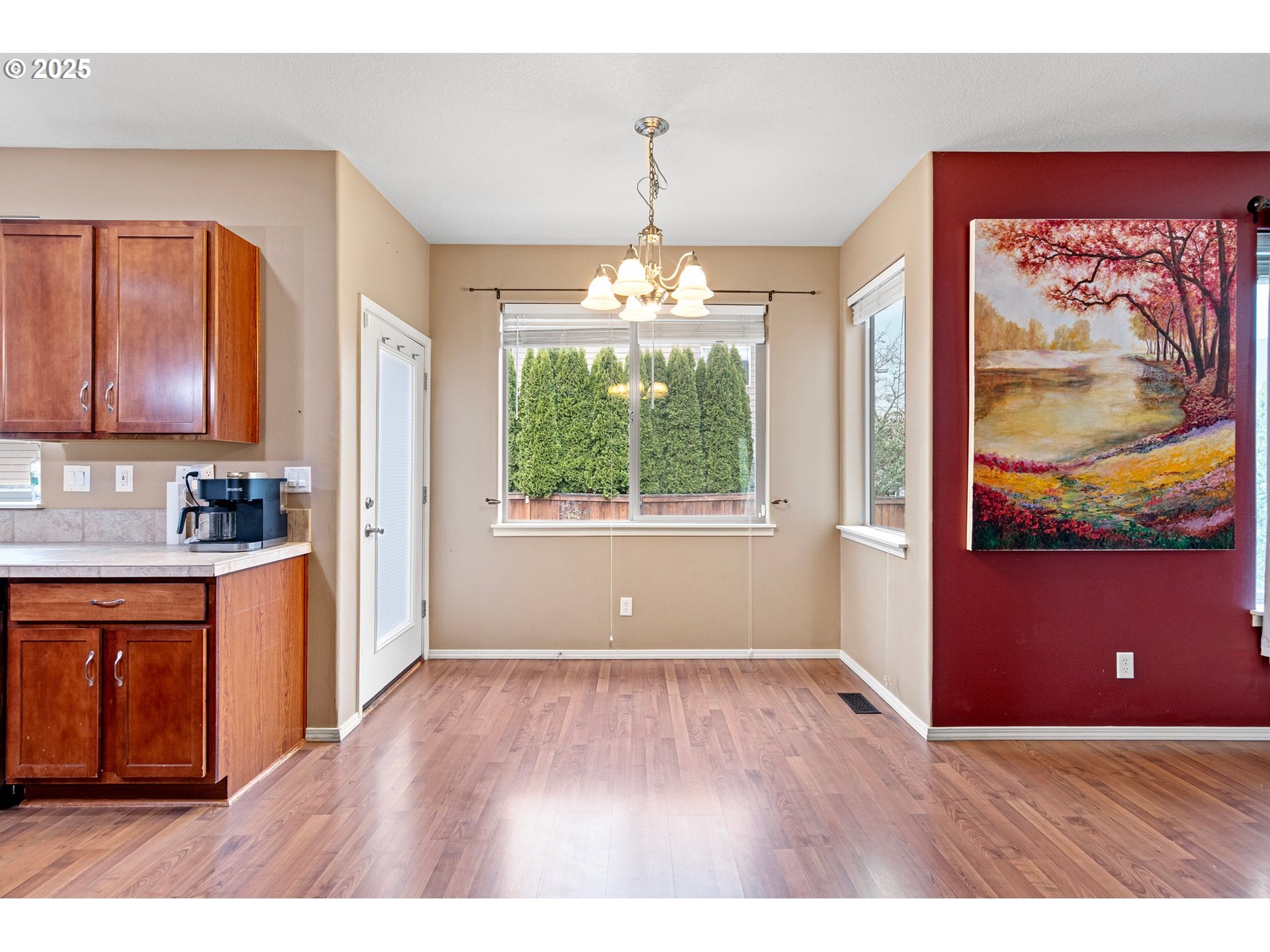 646 Raber Road Eugene, OR 97402 - Photo 13 of 44 a view of a kitchen with wooden floor and a ceiling fan