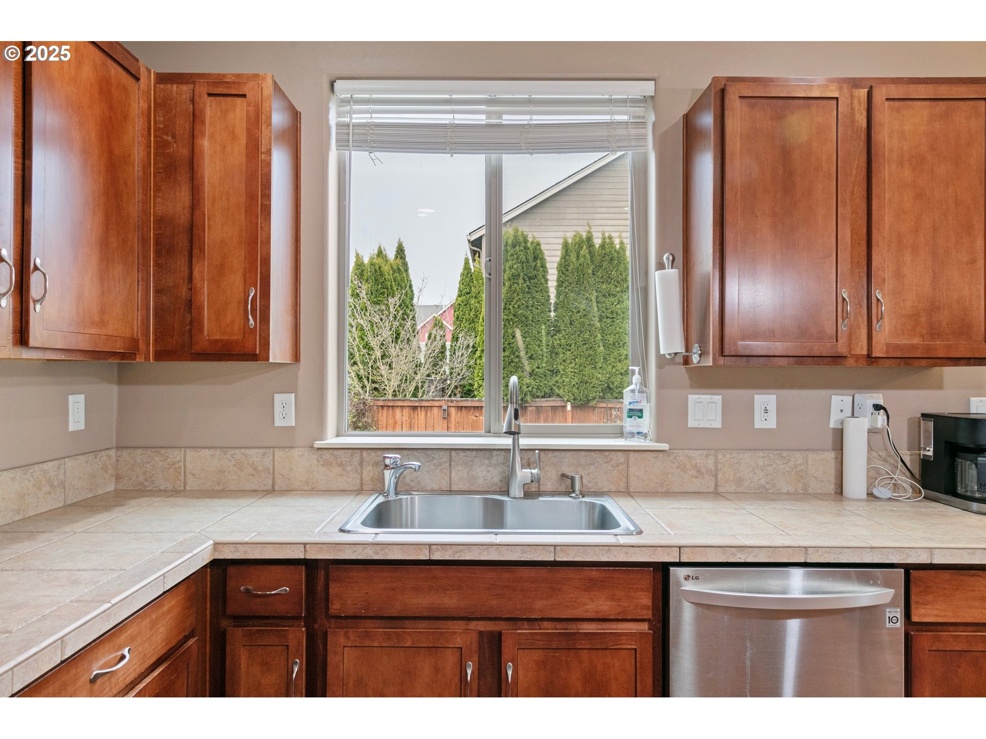 646 Raber Road Eugene, OR 97402 - Photo 19 of 44 a kitchen with stainless steel appliances granite countertop a sink a microwave cabinets and a counter space