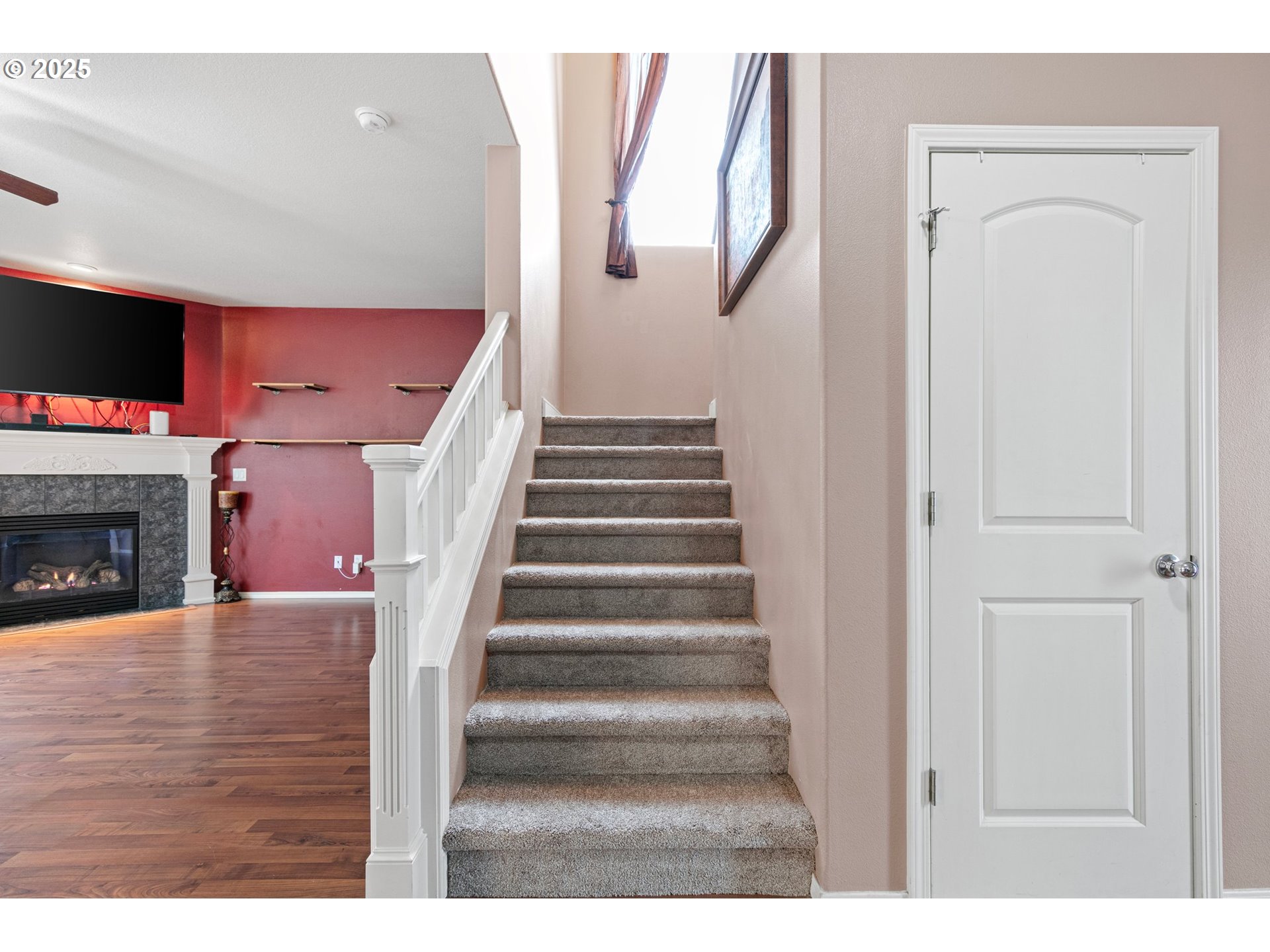 646 Raber Road Eugene, OR 97402 - Photo 21 of 44 a view of a livingroom with wooden floor and a fireplace
