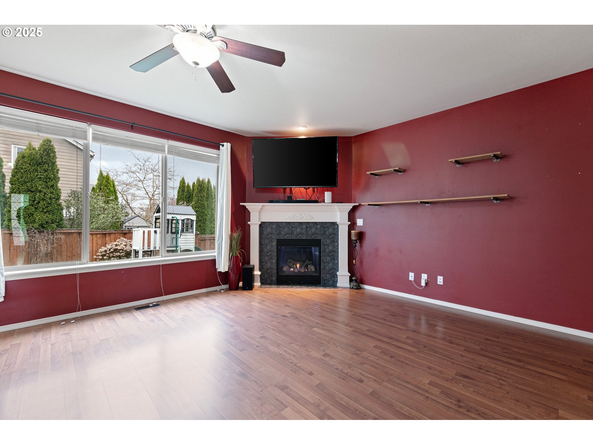 646 Raber Road Eugene, OR 97402 - Photo 9 of 44 a view of an empty room with a fireplace and a window