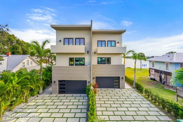 a terrace with outdoor seating and city view