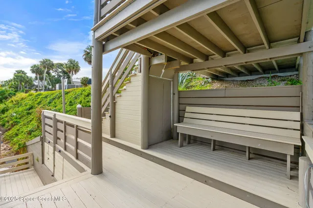 a view of cabinets a sink and a refrigerator in a kitchen