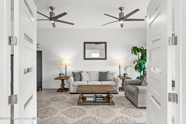 a black and white photo of a living room