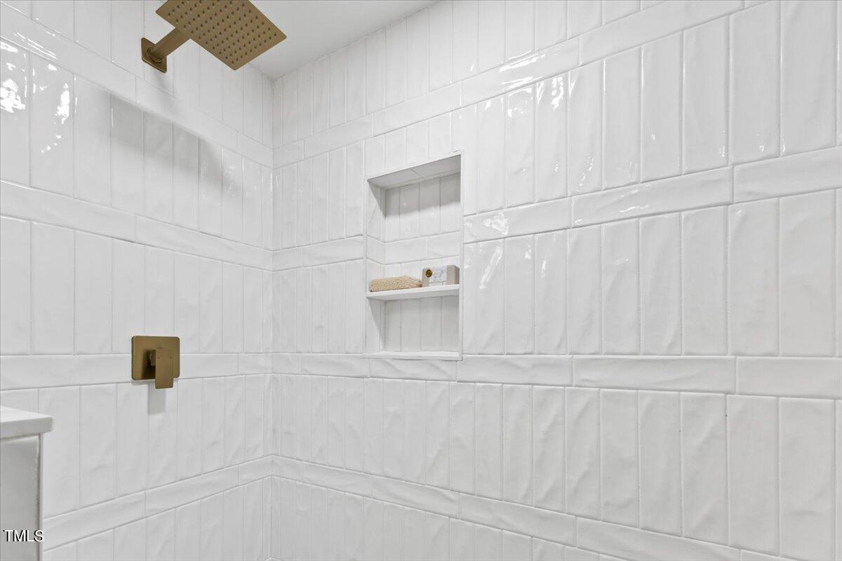 217 Brandon Court Raleigh, NC 27609 - Photo 19 of 30 a bathroom with a shower