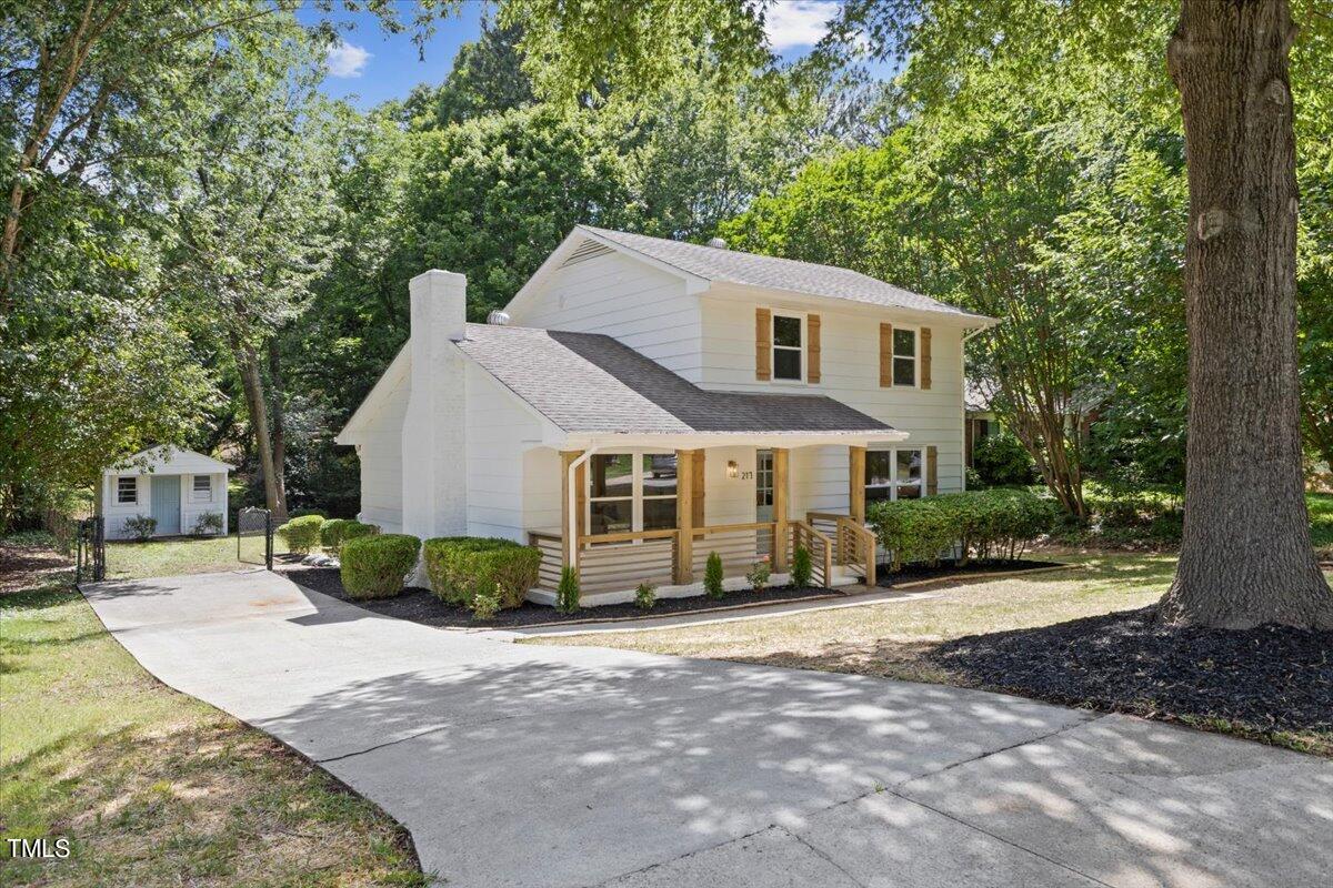 217 Brandon Court Raleigh, NC 27609 - Photo 2 of 30 a front view of a house with a garden