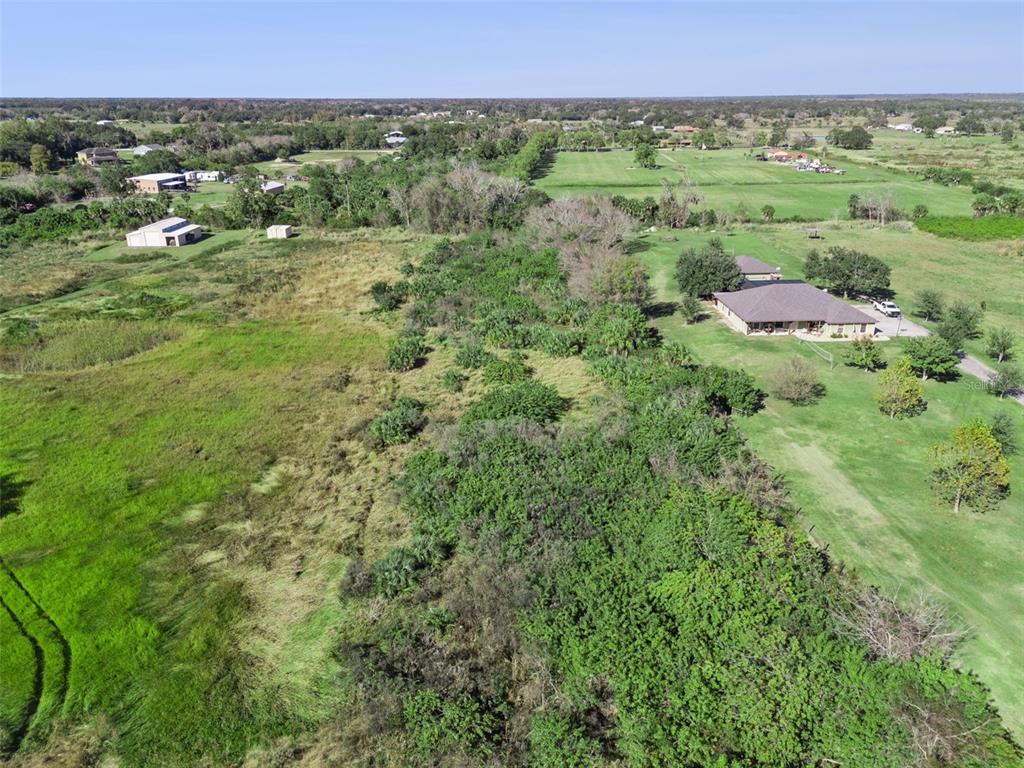 0 Huntington Avenue Mims, FL 32754 - Photo 8 of 21 a view of a lush green field