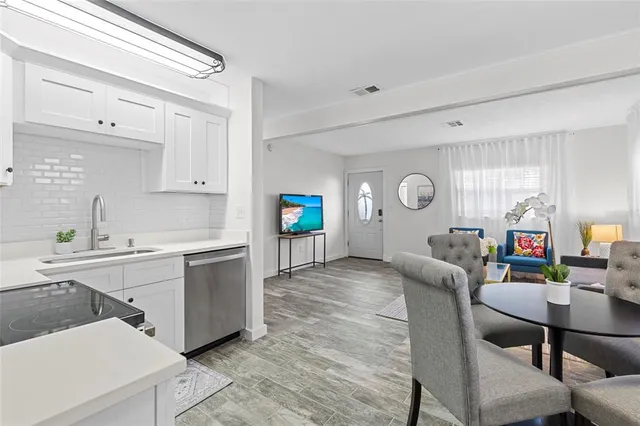 a kitchen with furniture and window
