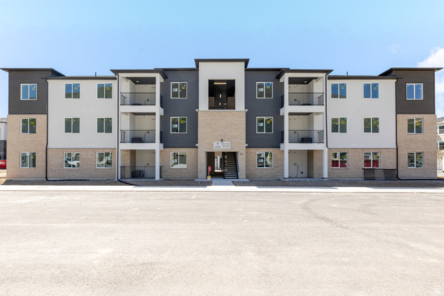 4668 Olive Avenue, Unit T202 Mapleton, UT 84664 - Photo 1 of 4 Contemporary multi-story building featuring a facade of light-colored brick, white siding, and dark gray siding