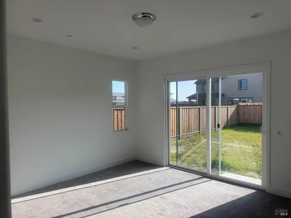 a spacious bathroom with a bathtub and a sink