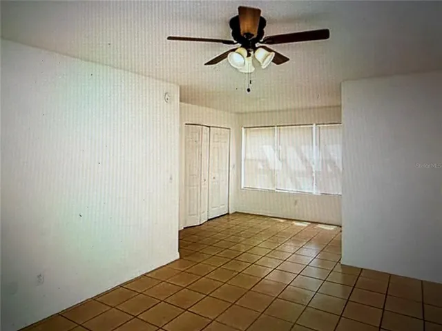 a view of an empty room and window