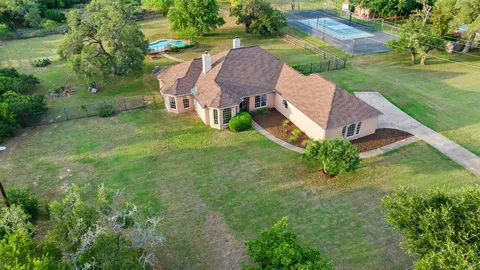 an aerial view of a house with garden