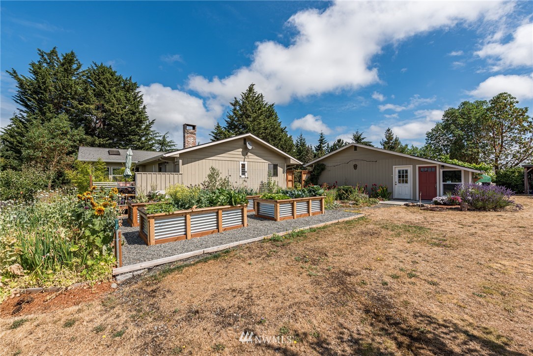 283 Williamson Road Sequim, WA 98382 - Photo 1 of 38 a view of a house with a yard