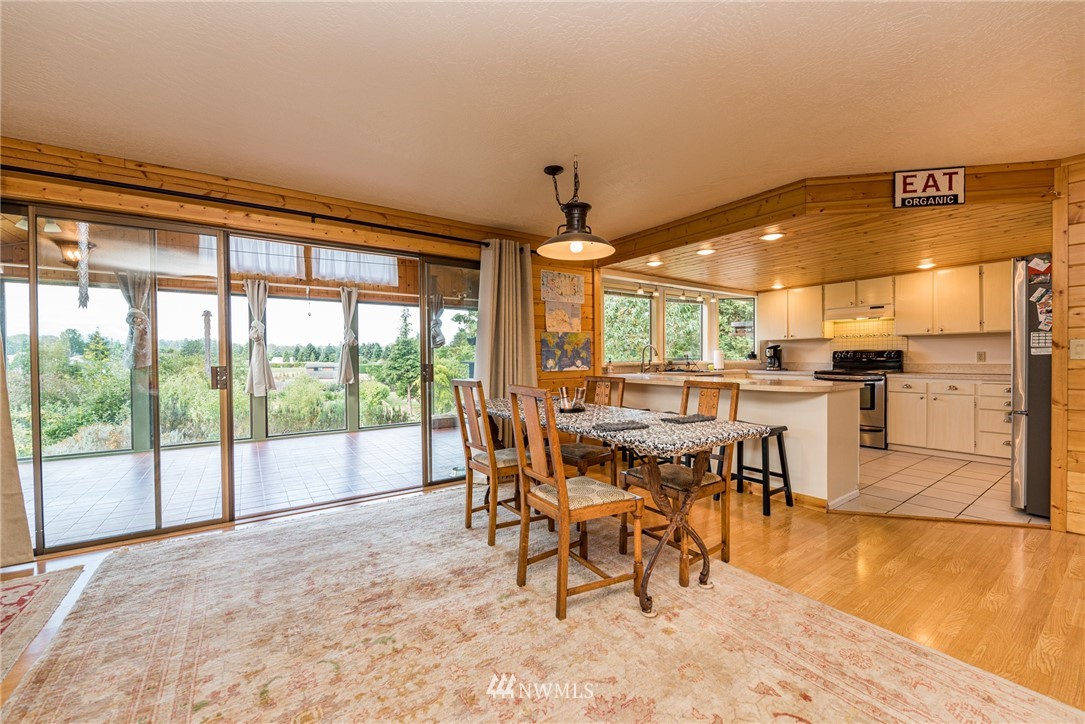 283 Williamson Road Sequim, WA 98382 - Photo 3 of 38 a dining area with furniture and a floor to ceiling window