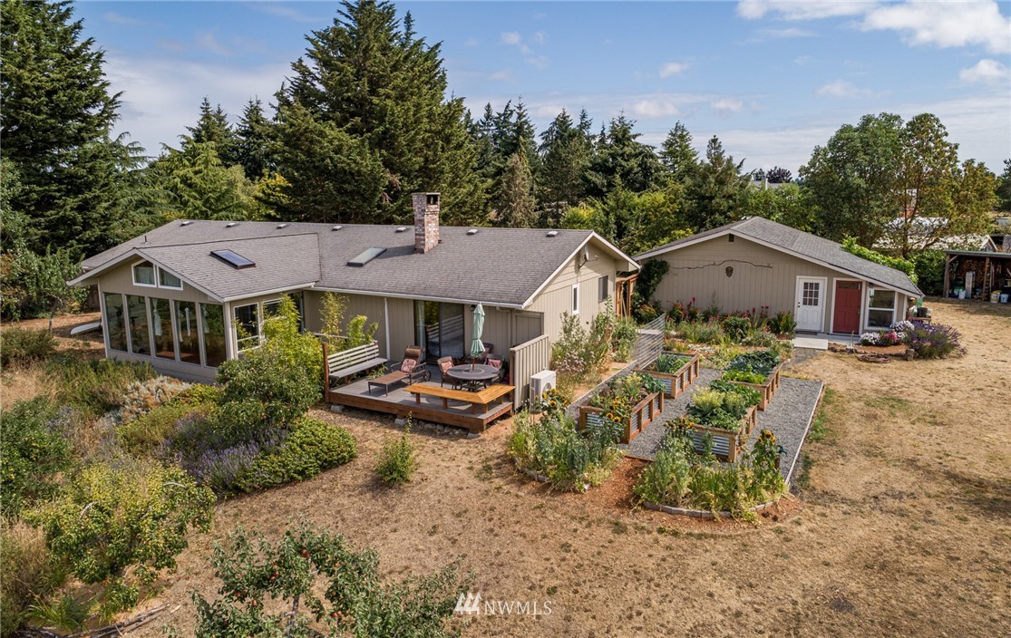 283 Williamson Road Sequim, WA 98382 - Photo 23 of 38 an aerial view of a house with swimming pool and sitting area