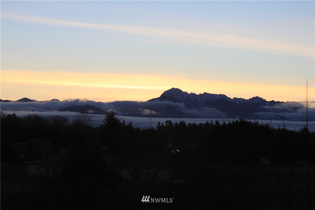 283 Williamson Road Sequim, WA 98382 - Photo 36 of 38 a view of an ocean with a mountain