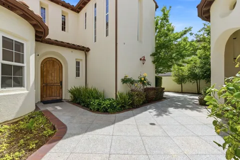 a front view of a house with garden