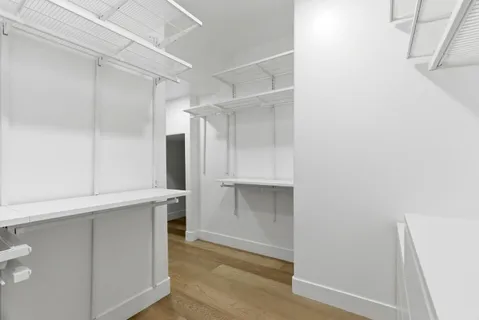 a view of an empty walk in closet