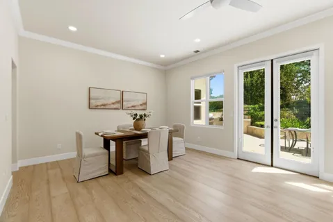 a view of a livingroom with furniture window and wooden floor