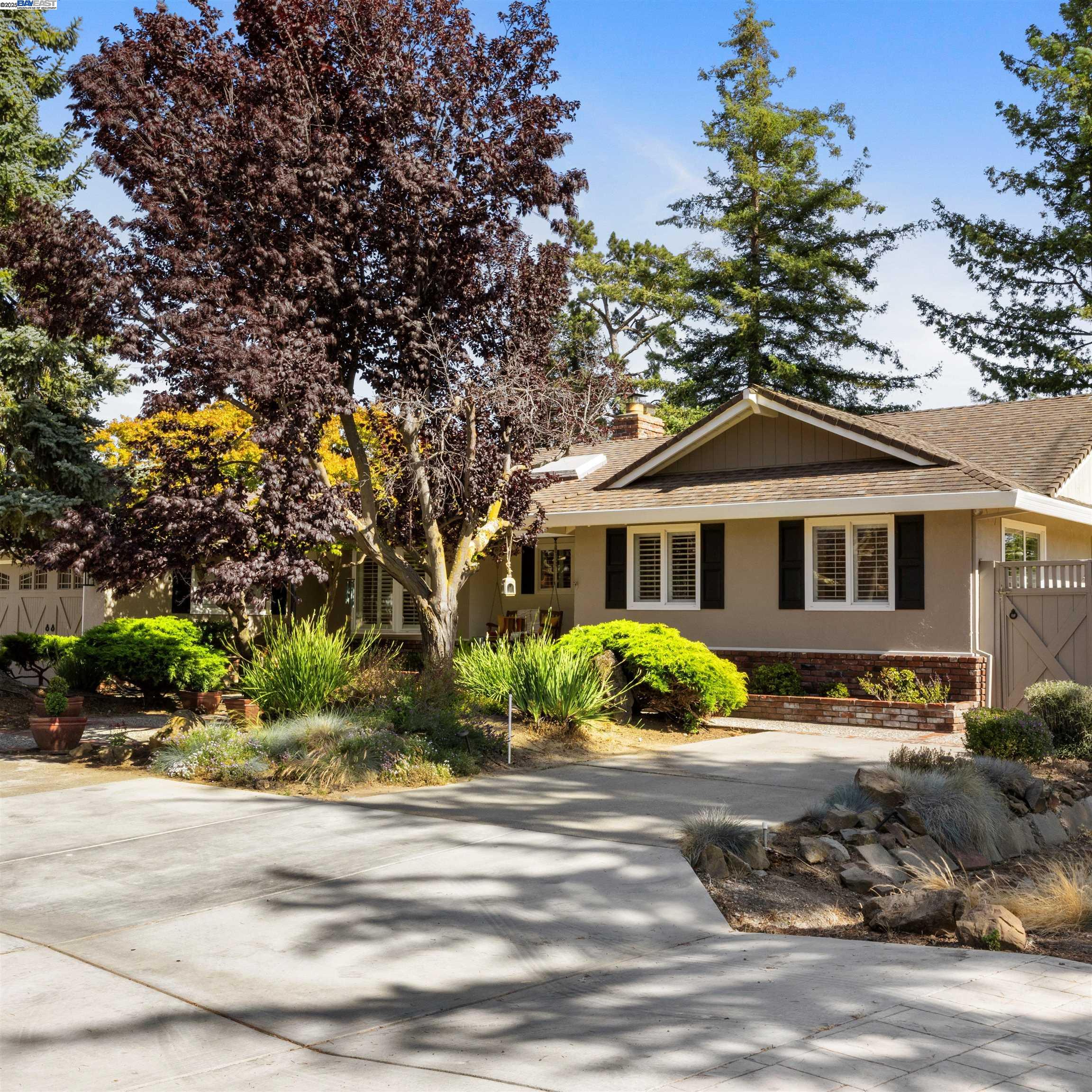 18767 Lamson Road Castro Valley, CA 94546 - Photo 1 of 1 a front view of a house with a garden
