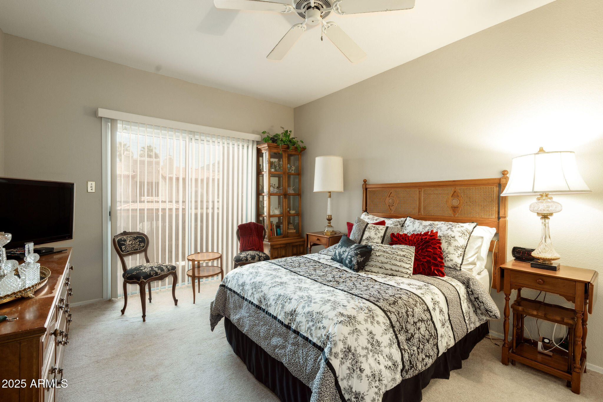 10410 North Cave Creek Road, Unit 2035 Phoenix, AZ 85020 - Photo 11 of 20 a bedroom with a bed and a flat screen tv