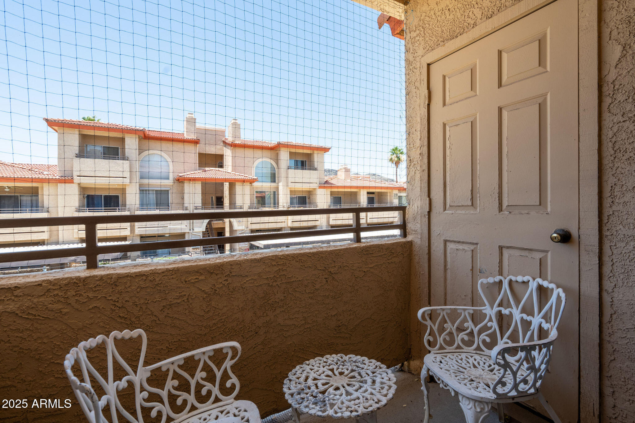 10410 North Cave Creek Road, Unit 2035 Phoenix, AZ 85020 - Photo 14 of 20 a balcony with furniture and window