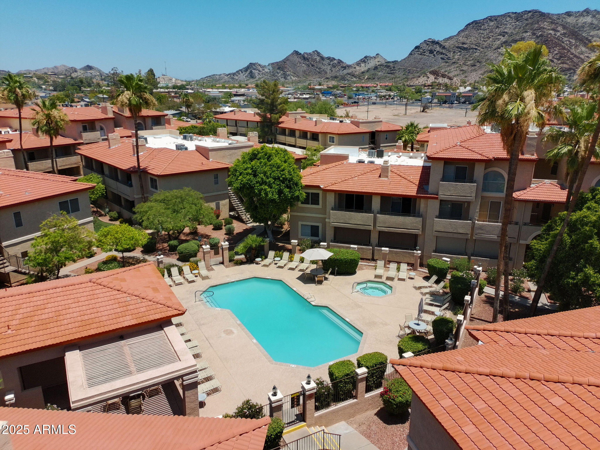 10410 North Cave Creek Road, Unit 2035 Phoenix, AZ 85020 - Photo 16 of 20 a view of a patio with chairs and a table and chairs