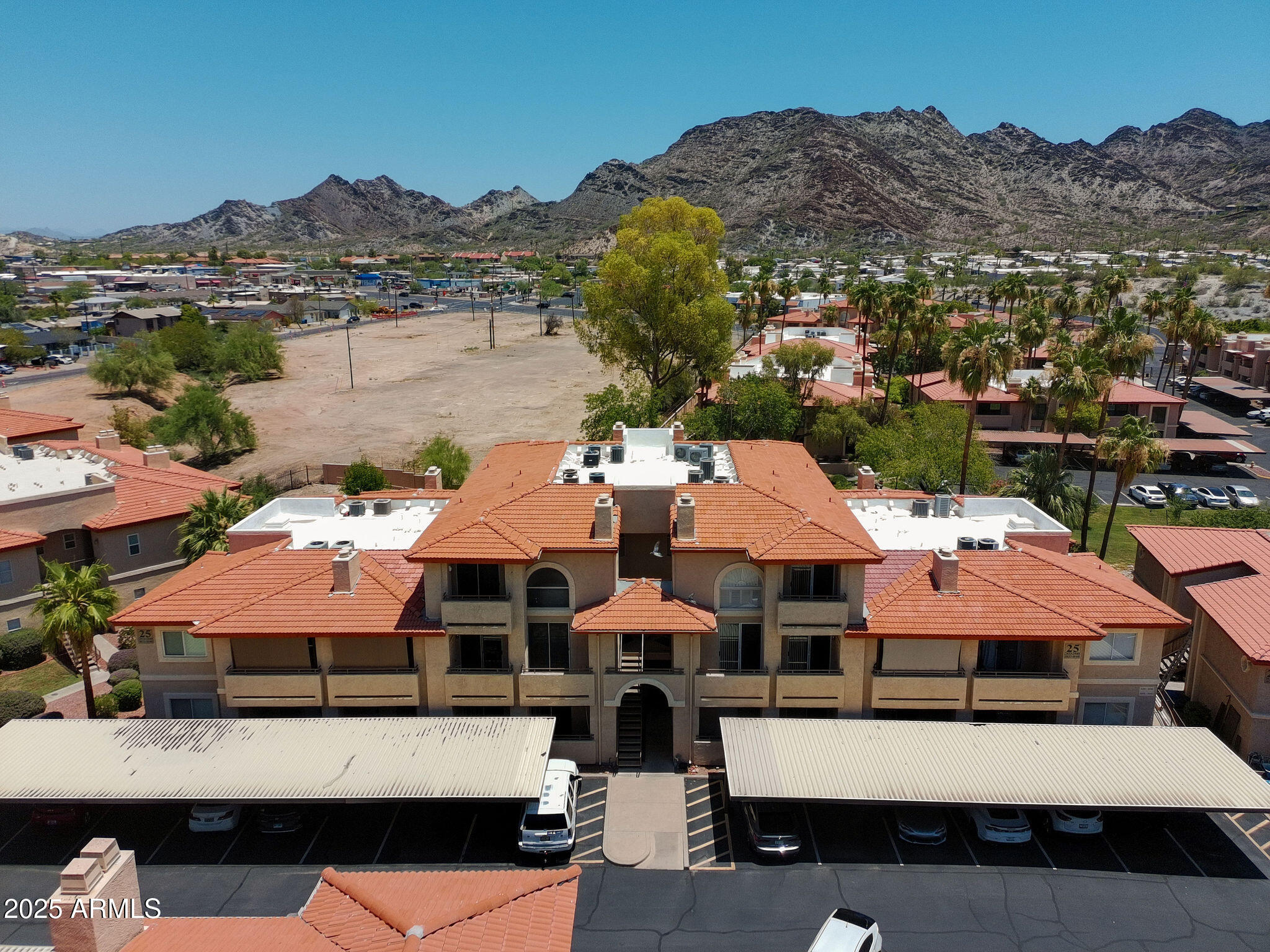 10410 North Cave Creek Road, Unit 2035 Phoenix, AZ 85020 - Photo 19 of 20 a view of a patio with swimming pool and mountains
