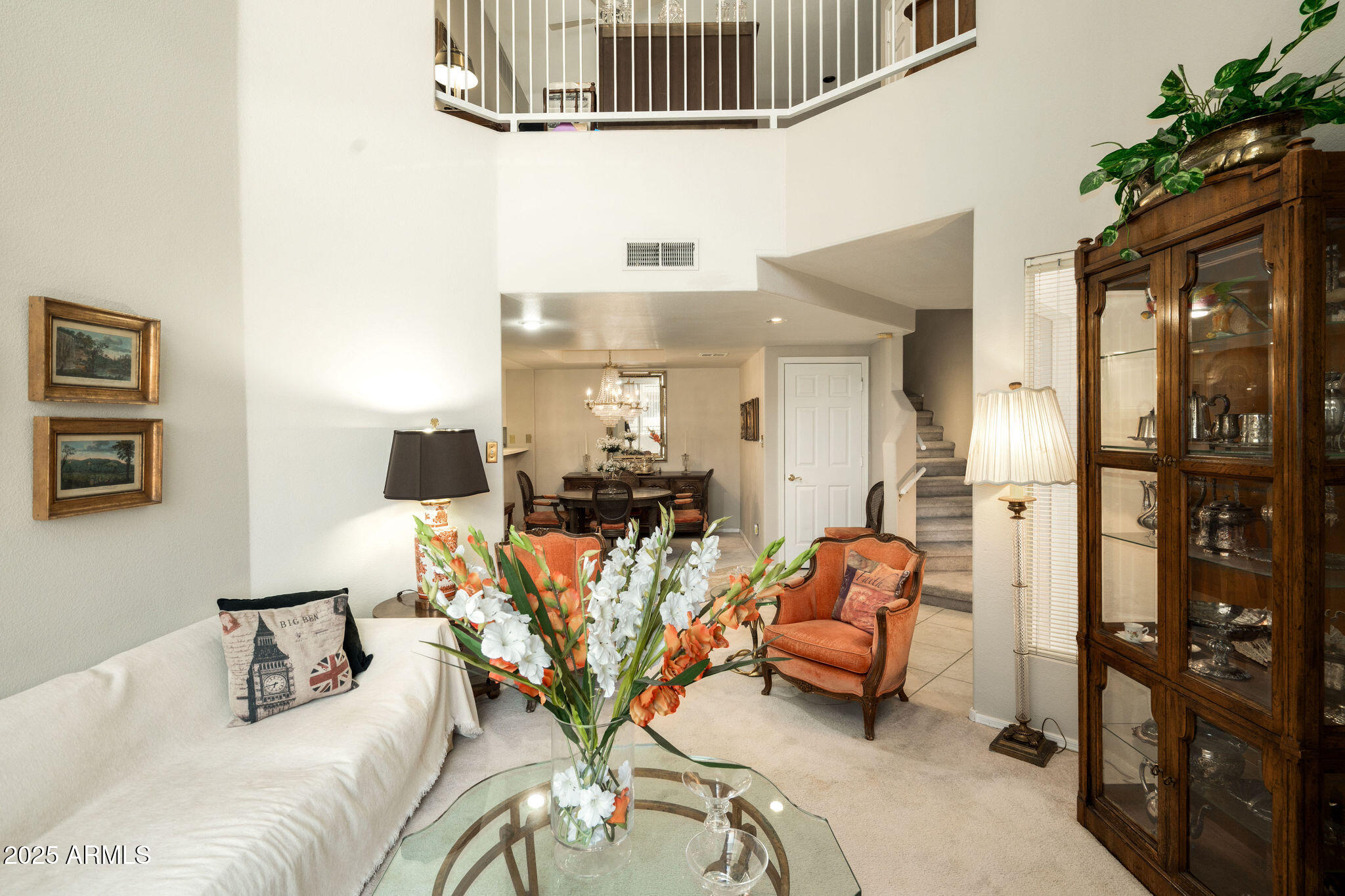 10410 North Cave Creek Road, Unit 2035 Phoenix, AZ 85020 - Photo 2 of 20 a living room with furniture or couch and a potted plant