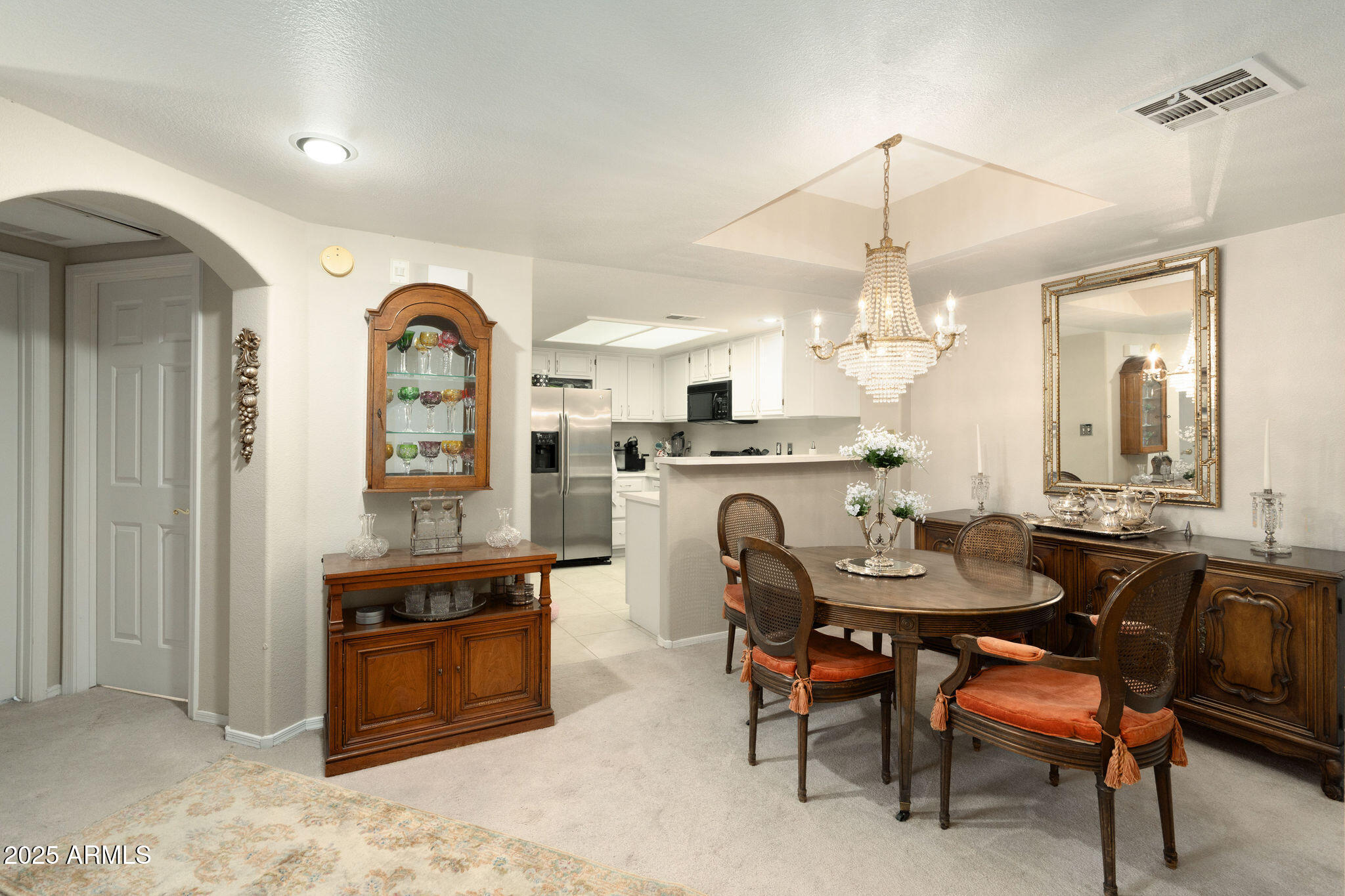 10410 North Cave Creek Road, Unit 2035 Phoenix, AZ 85020 - Photo 3 of 20 a dining room with a wooden table and chairs