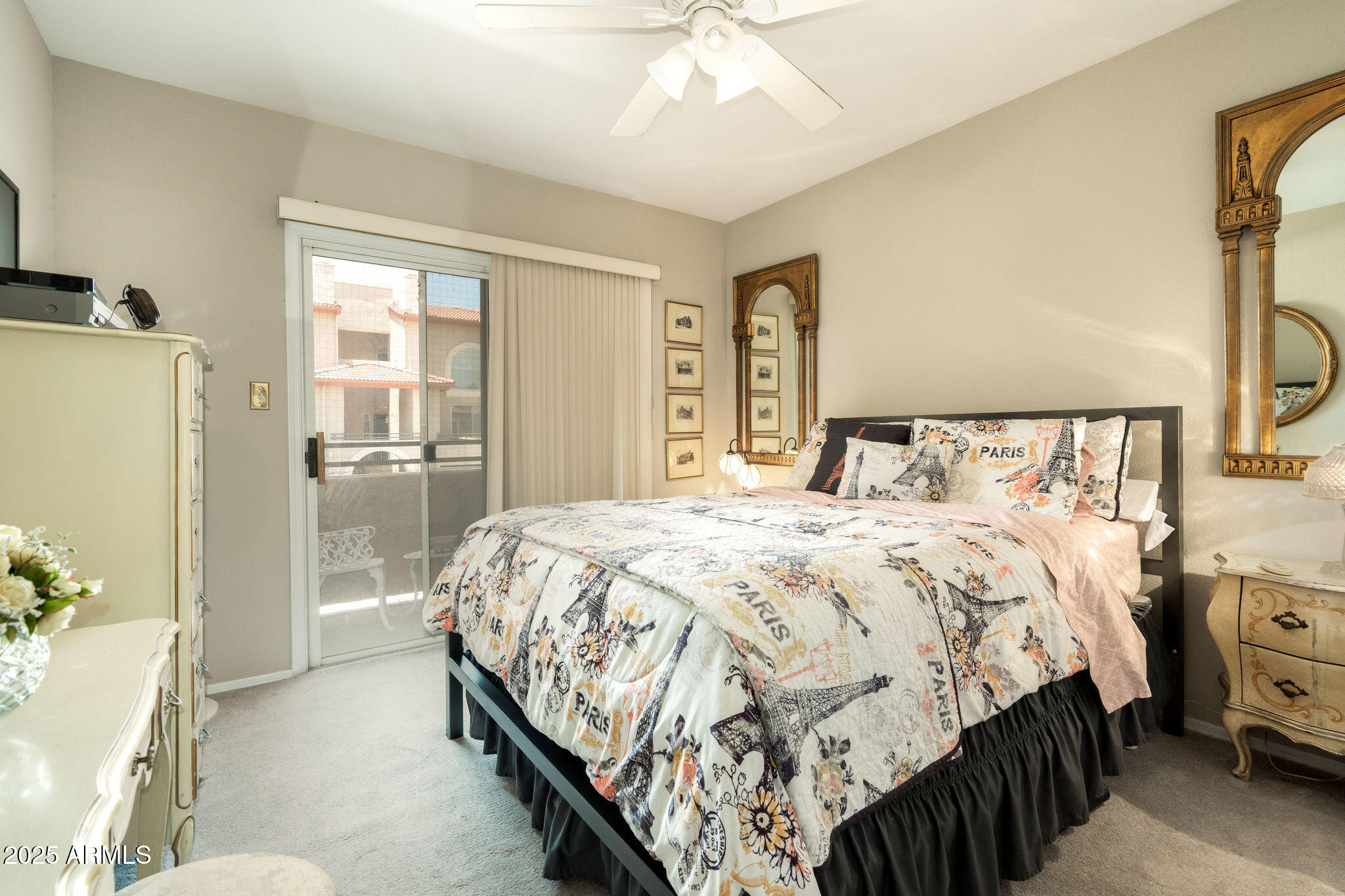 10410 North Cave Creek Road, Unit 2035 Phoenix, AZ 85020 - Photo 7 of 20 a bedroom with a bed and a chandelier