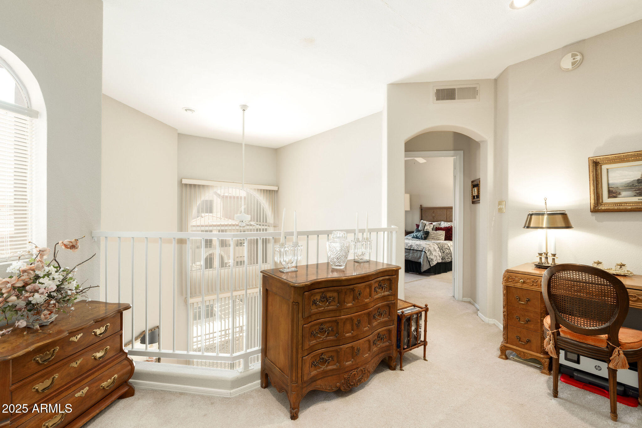 10410 North Cave Creek Road, Unit 2035 Phoenix, AZ 85020 - Photo 8 of 20 a bedroom with furniture and a window