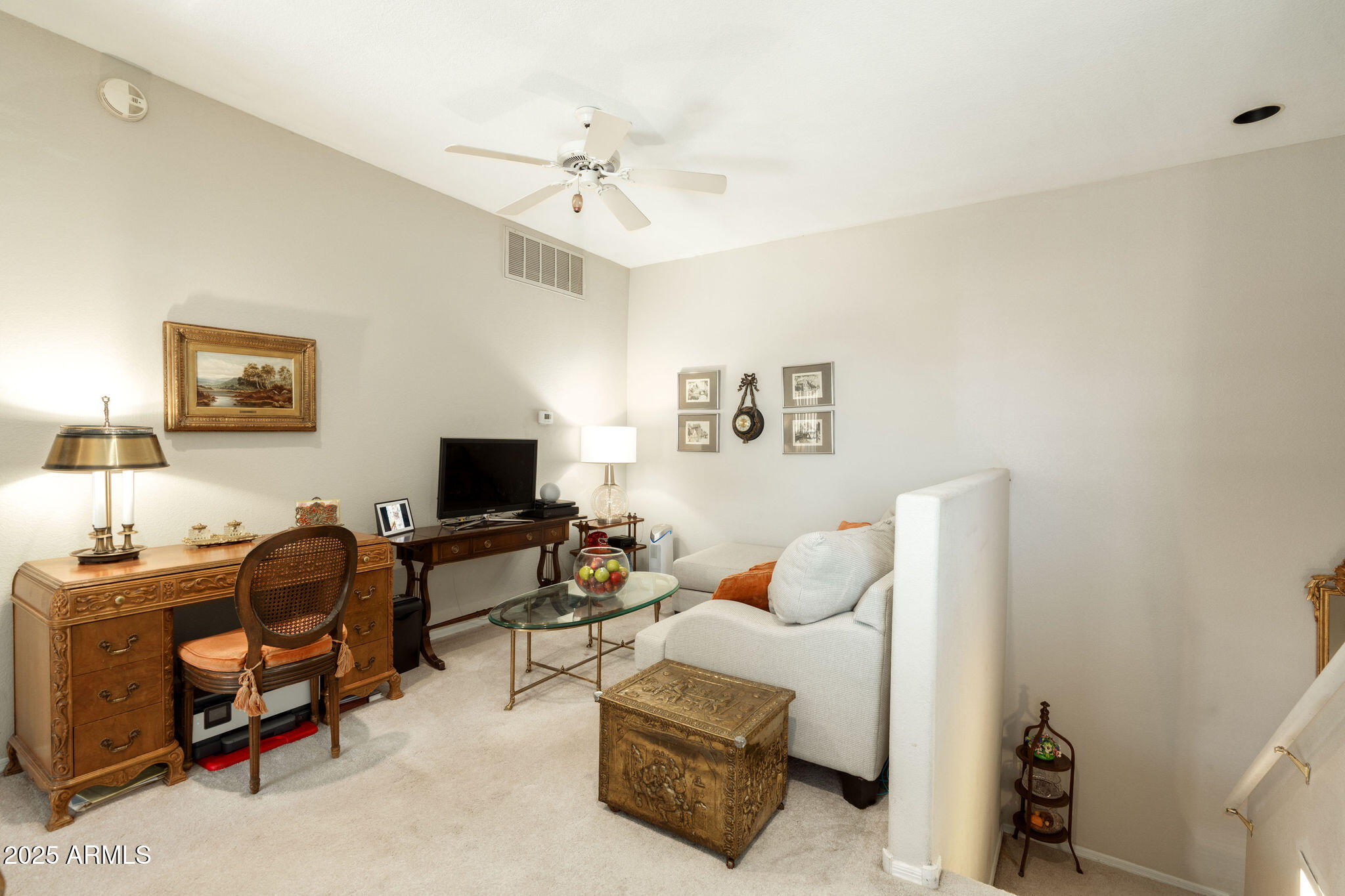 10410 North Cave Creek Road, Unit 2035 Phoenix, AZ 85020 - Photo 9 of 20 a living room with furniture and a flat screen tv