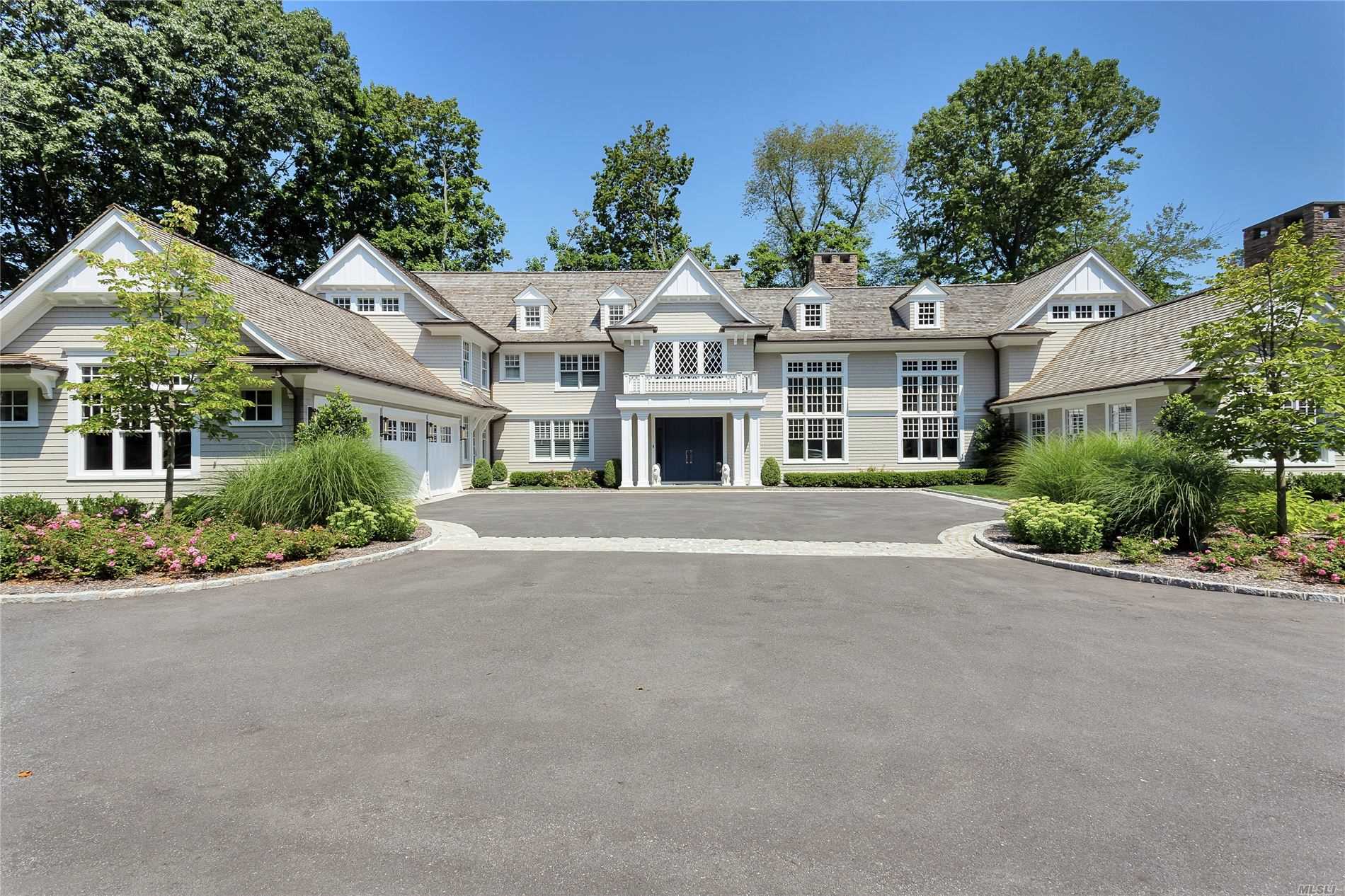 27 Cow Neck Road Sands Point, NY 11050 - Photo 1 of 1 front view of a house with a yard
